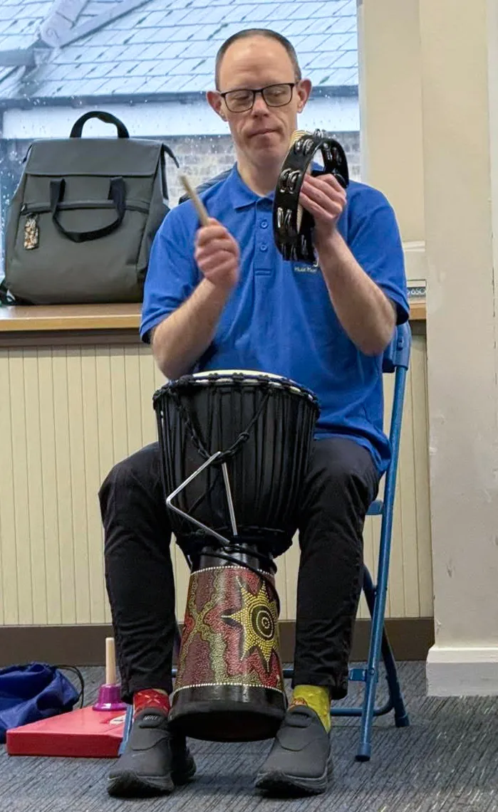 Service user playing an instrument